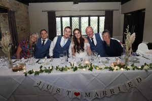 bride and groom with family