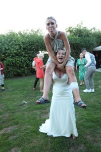 bridesmaid on brides shoulders