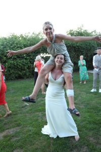 bridesmaid on brides shoulders