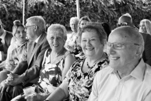 guests wait for ceremony in garden wedding