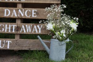 watering can with flowers