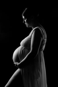 black and white image of heavily pregnant lady