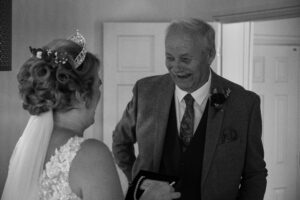 father sees daughter in wedding dress for teh first time