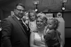 bride and groom with daughters at woodland waters