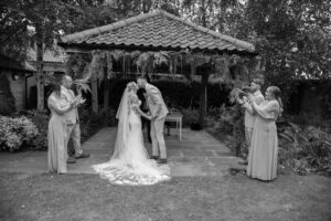 bride and groom share first kiss at doddington hall