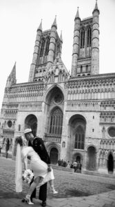 bride and groom recreate famous VE day photo outside Lincoln cathedral