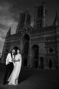 dramatic image of bride and groom at Lincoln cathedral
