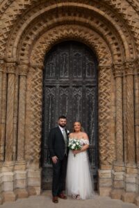 bride and groom in doorway of Lincoln cathedral