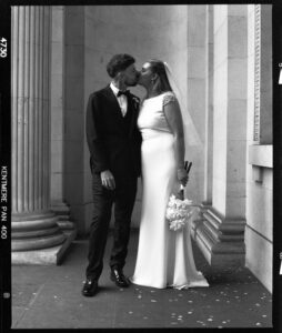 bride and groom kissing at Marylebone registry office