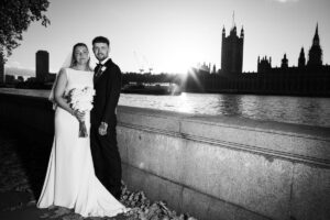 bride and groom with parliament in background