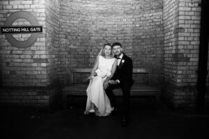 bride and groom at Notting Hill Gate station