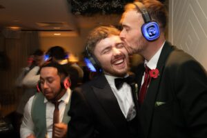 groom and friend at silent disco