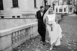 bride and friend walks to marylebone registry office